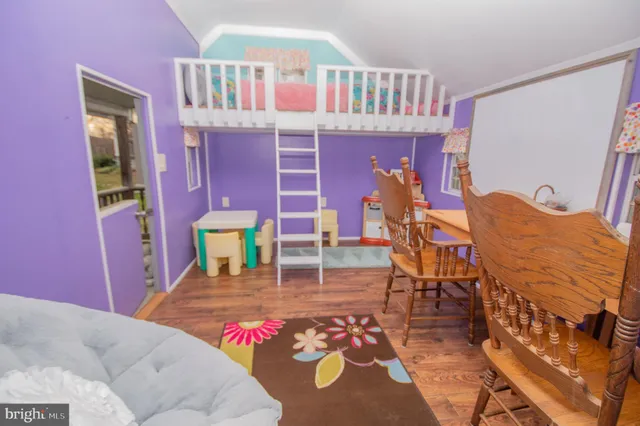 a bed room with a bed and a book shelf