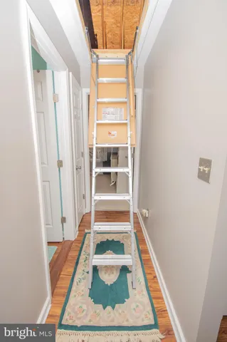 a room with wooden floor and window