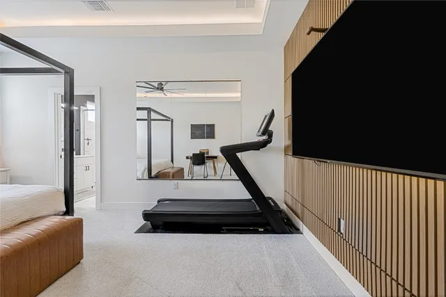 a view of a livingroom with furniture and flat screen tv