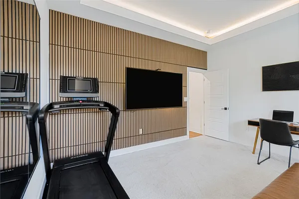 a view of a livingroom with furniture and flat screen tv