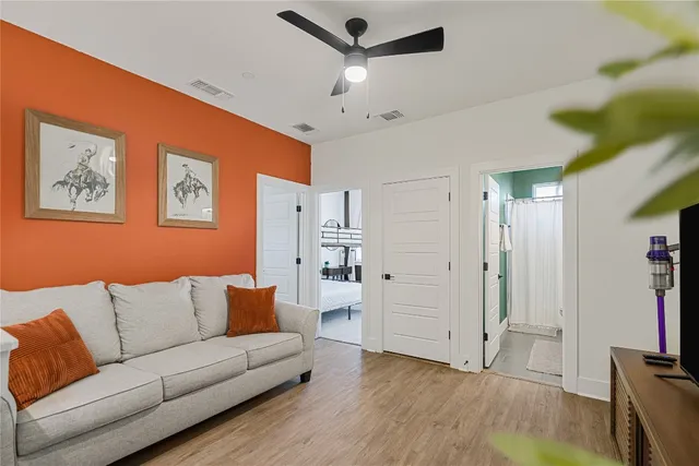 a living room with furniture and white walls