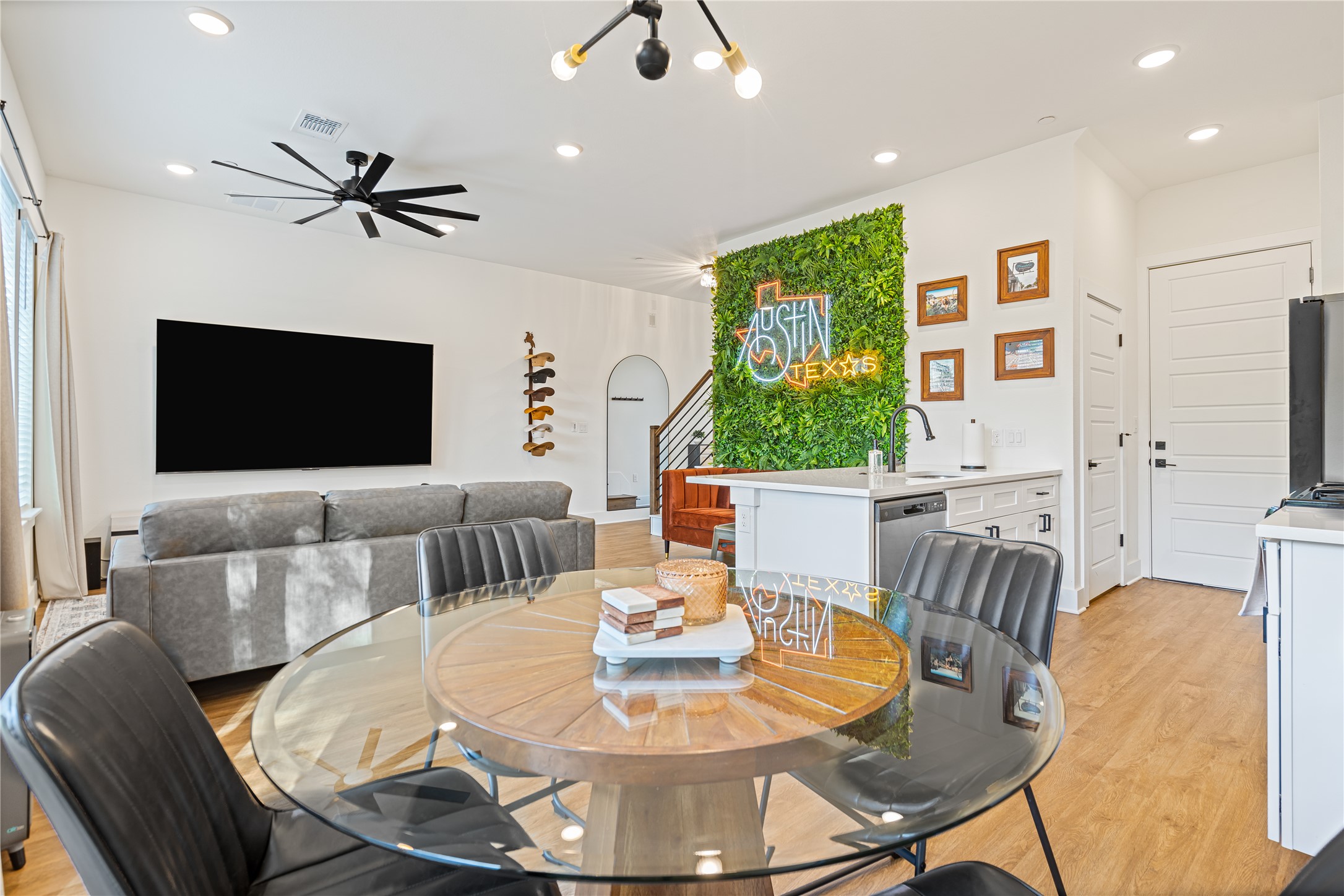 1811 Webberville Road, Unit 4103 Austin, TX 78721 - Photo 2 of 35 a living room with furniture and a flat screen tv