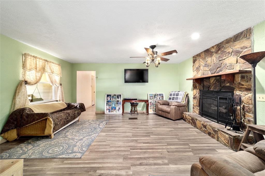15755 Southwest 90th Avenue Dunnellon, FL 34432 - Photo 15 of 55 a living room with furniture and a flat screen tv
