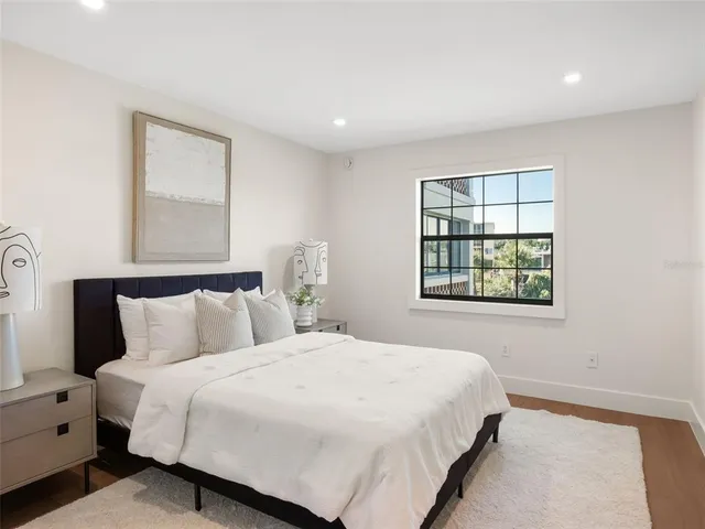 a bedroom with a bed and a window