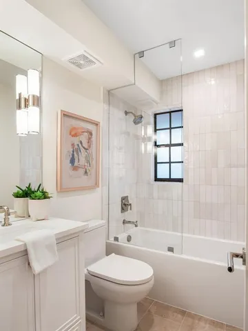 a bathroom with a sink toilet and bathtub