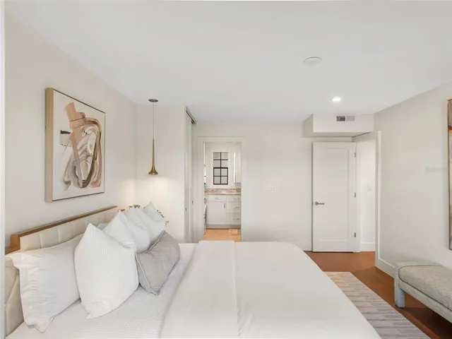 a bedroom with a bed and a couch