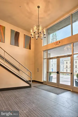 a view of a swimming pool with outdoor seating