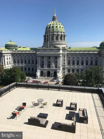 a view of balcony with furniture