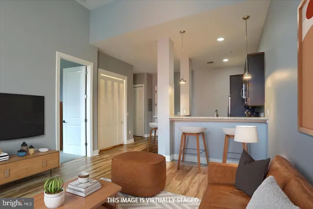 a kitchen with stainless steel appliances a stove a microwave a sink and cabinets