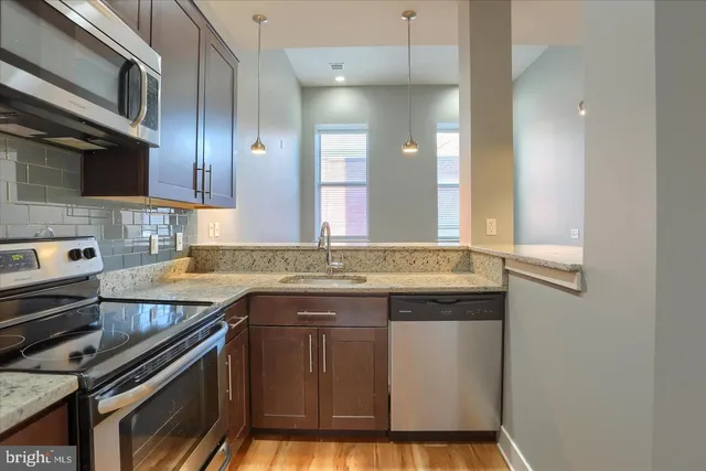 a bedroom with a bed and a table in it