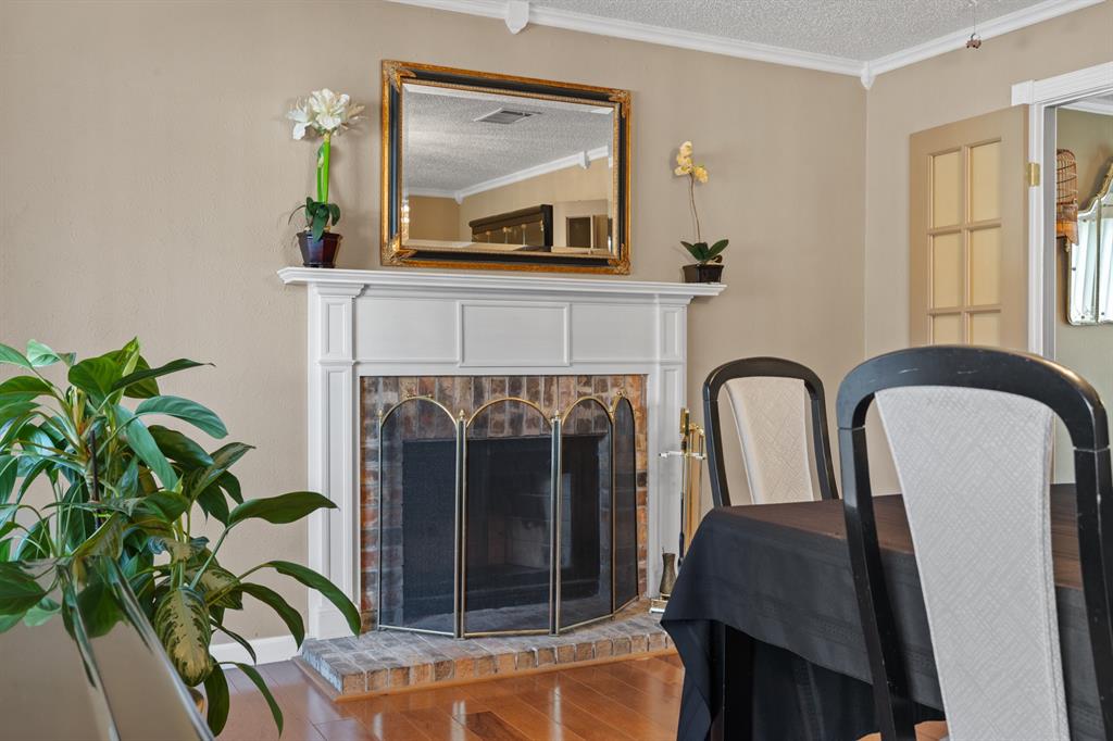 3708 Windsong Lane Bedford, TX 76021 - Photo 11 of 29 a living room with furniture and a fireplace