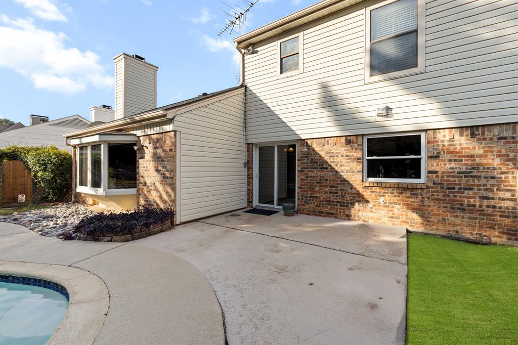 3708 Windsong Lane Bedford, TX 76021 - Photo 13 of 35 a front view of a house with a yard and garage