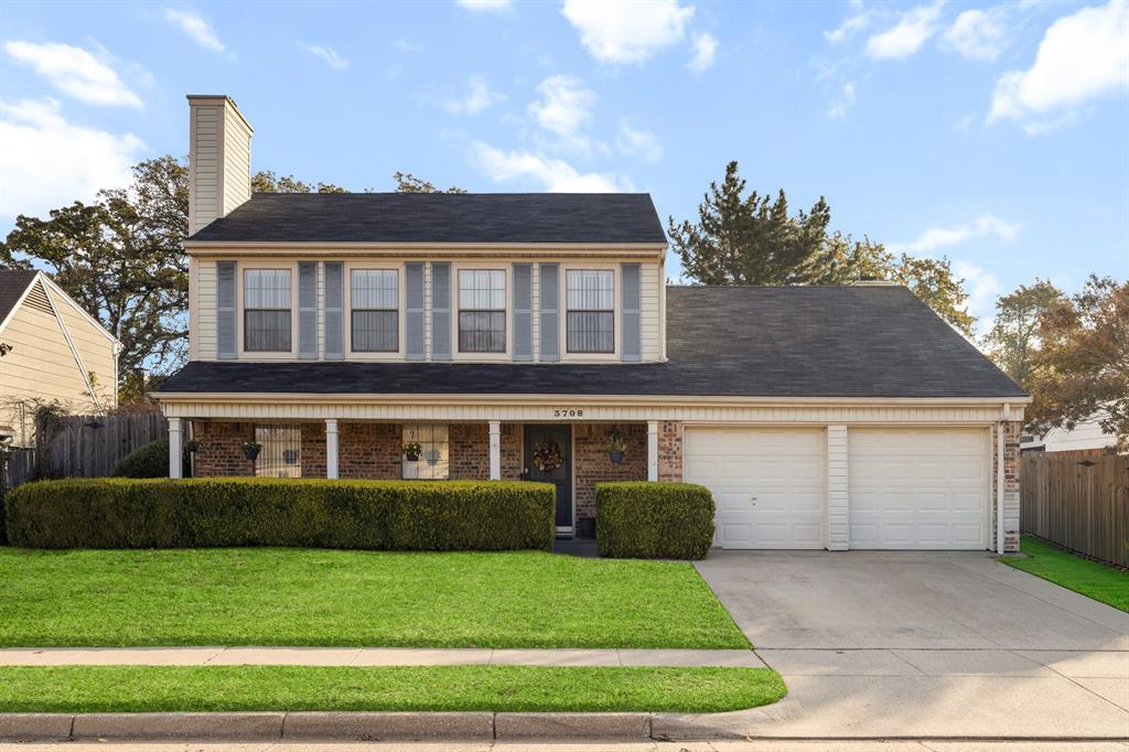 3708 Windsong Lane Bedford, TX 76021 - Photo 13 of 29 a front view of a house with a yard