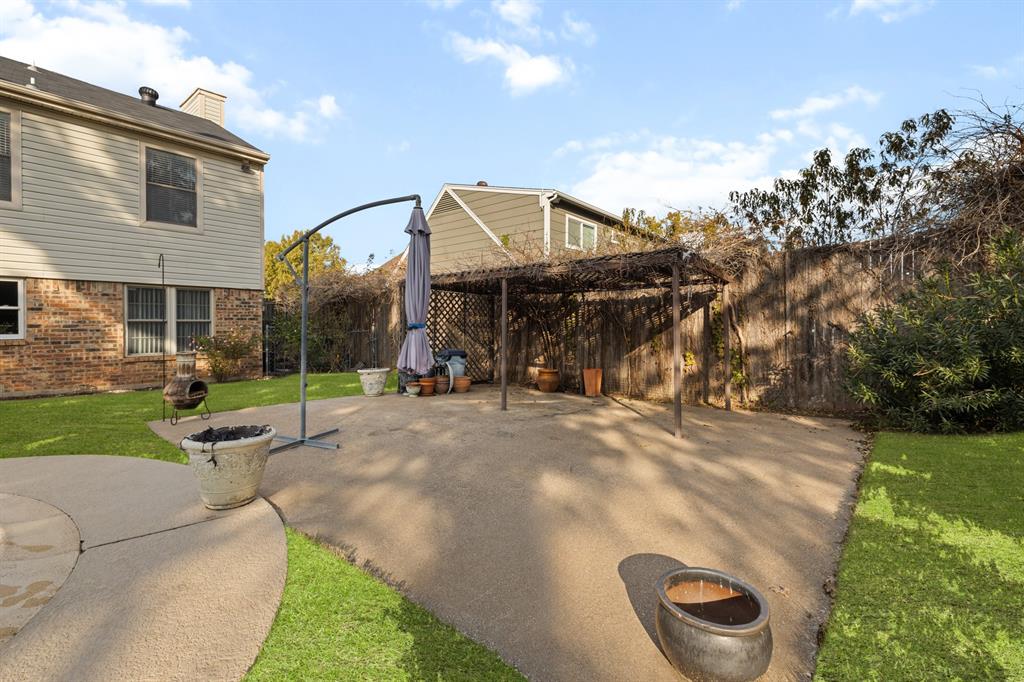 3708 Windsong Lane Bedford, TX 76021 - Photo 14 of 35 a view of a house with a backyard
