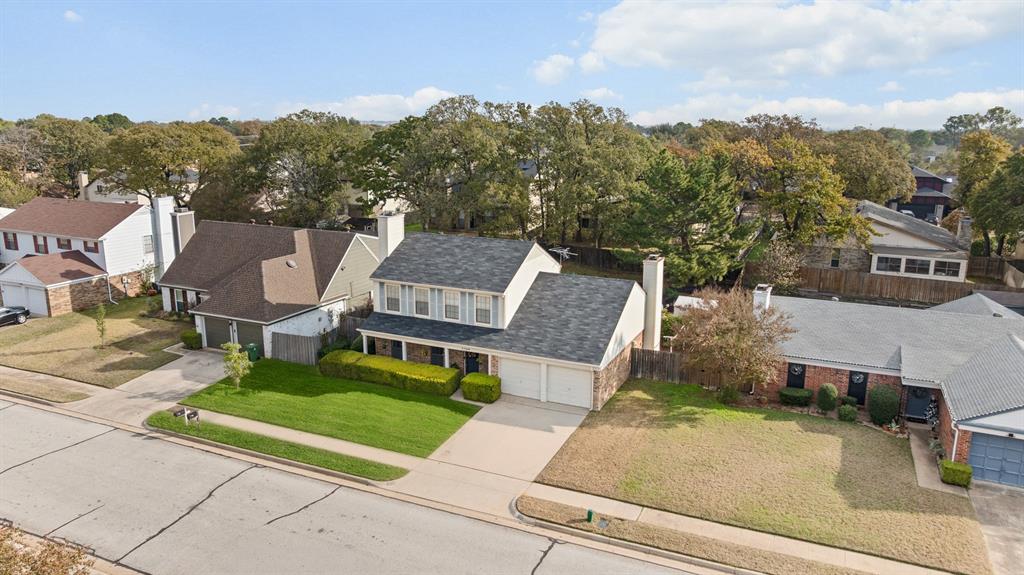 3708 Windsong Lane Bedford, TX 76021 - Photo 15 of 29 a view of a patio with a table and chairs