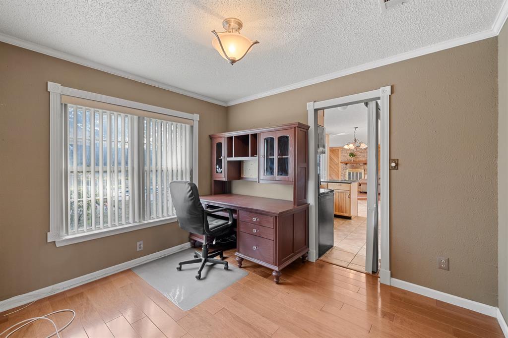 3708 Windsong Lane Bedford, TX 76021 - Photo 17 of 29 a view of a workspace with furniture and a window