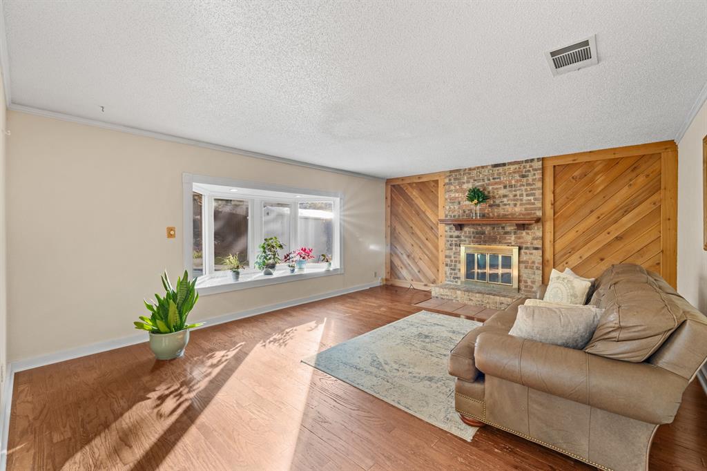3708 Windsong Lane Bedford, TX 76021 - Photo 24 of 29 a living room with furniture and a large window