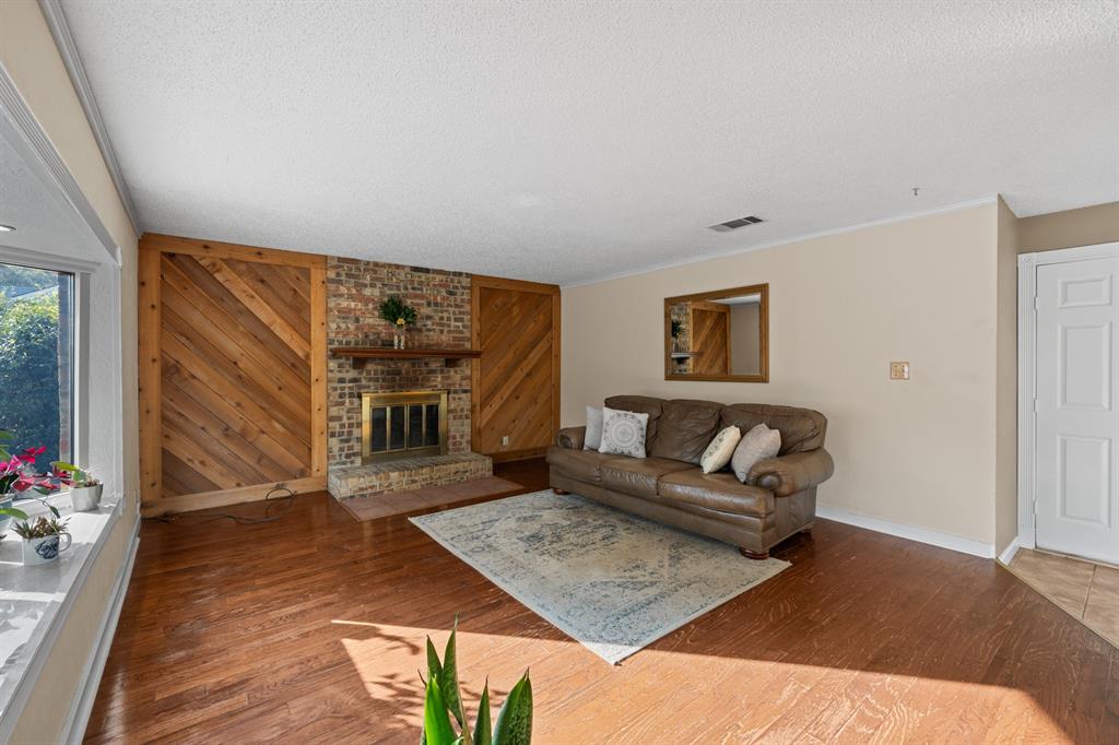 3708 Windsong Lane Bedford, TX 76021 - Photo 26 of 35 a living room with furniture and a flat screen tv