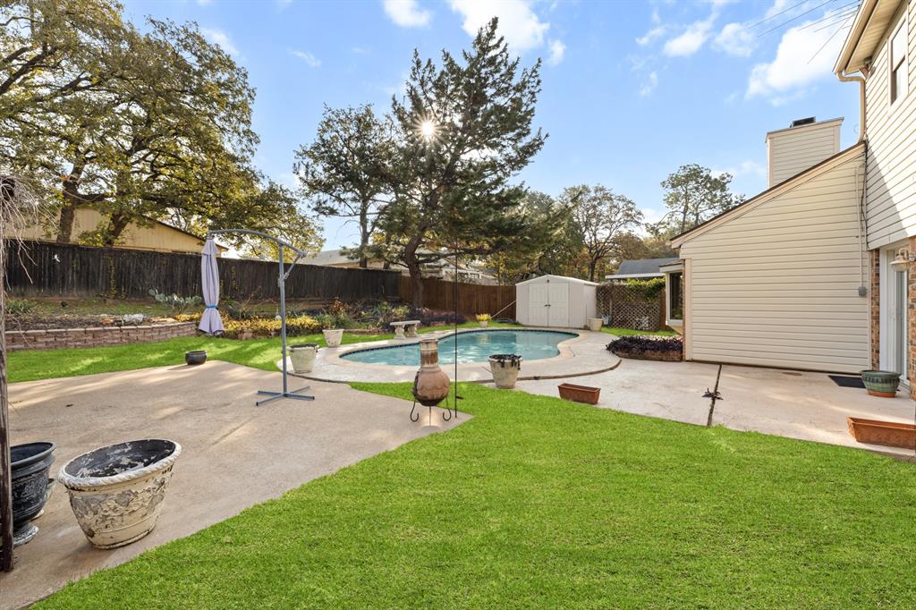3708 Windsong Lane Bedford, TX 76021 - Photo 29 of 35 a view of a backyard with sitting area
