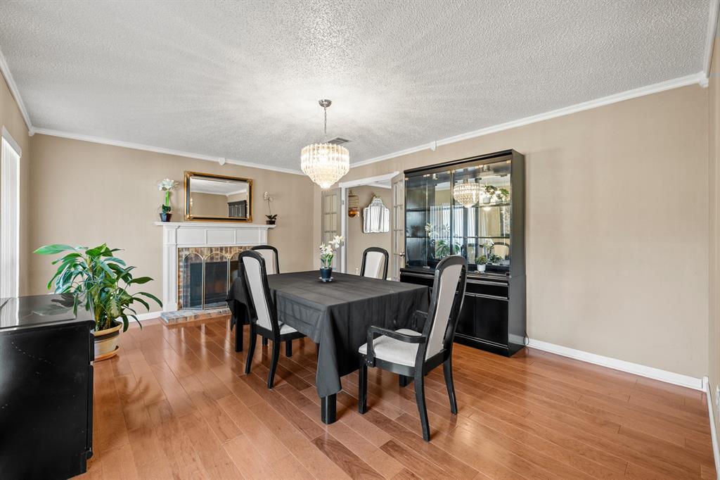3708 Windsong Lane Bedford, TX 76021 - Photo 7 of 29 a view of a dining room with furniture window and wooden floor