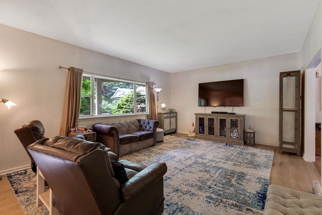 15 Conestoga Road Lexington, MA 02421 - Photo 3 of 31 a living room with furniture and a flat screen tv