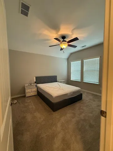 a bathroom with a double vanity sink mirror and toilet