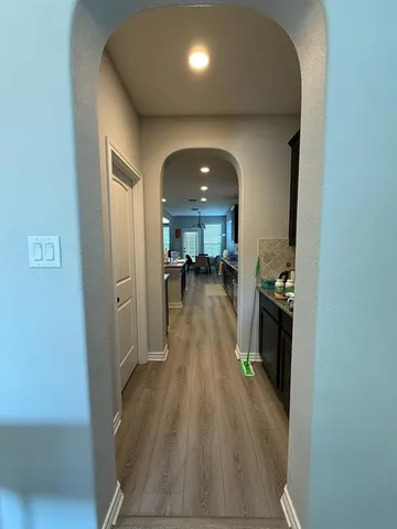 wooden floor in kitchen and a room with wooden floor