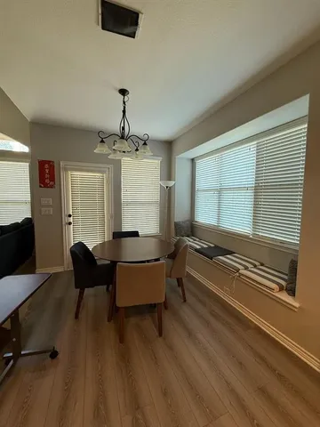 a kitchen with stainless steel appliances granite countertop sink stove top oven and cabinets