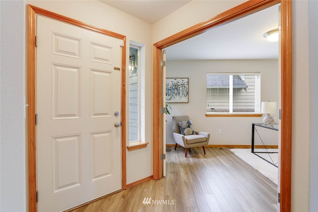6731 Southeast 3rd Street Renton, WA 98059 - Photo 16 of 31 a living room with furniture and a wooden floor