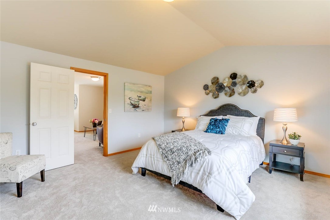 6731 Southeast 3rd Street Renton, WA 98059 - Photo 18 of 31 a bedroom with a bed and a couch