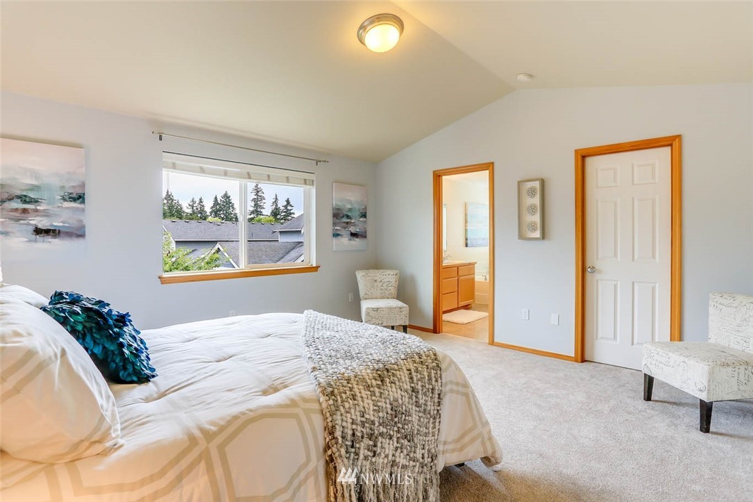 6731 Southeast 3rd Street Renton, WA 98059 - Photo 19 of 31 a bedroom with a bed and a painting on the wall
