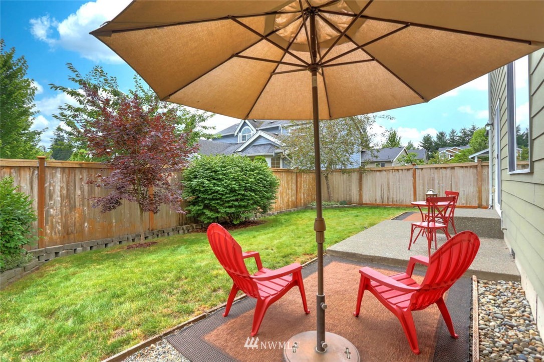 6731 Southeast 3rd Street Renton, WA 98059 - Photo 29 of 31 a view of an outdoor sitting area with furniture and umbrella