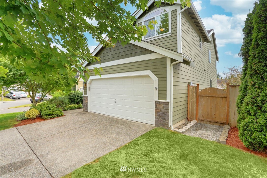 6731 Southeast 3rd Street Renton, WA 98059 - Photo 30 of 31 a front view of a house with a yard