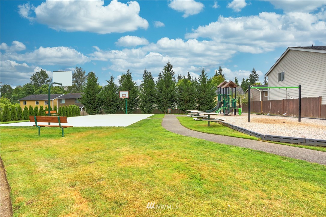 6731 Southeast 3rd Street Renton, WA 98059 - Photo 31 of 31 a swimming pool with outdoor seating and yard