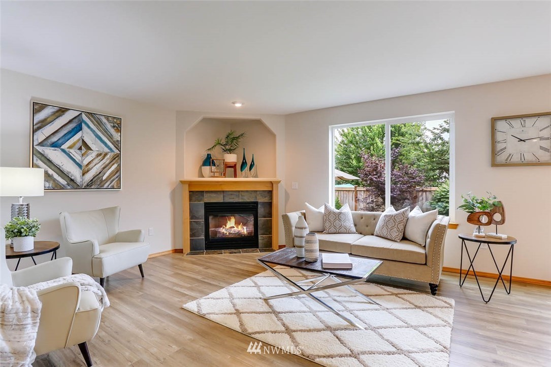 6731 Southeast 3rd Street Renton, WA 98059 - Photo 5 of 31 a living room with furniture and a fireplace
