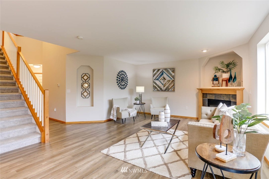 6731 Southeast 3rd Street Renton, WA 98059 - Photo 6 of 31 a living room with furniture and a wooden floor