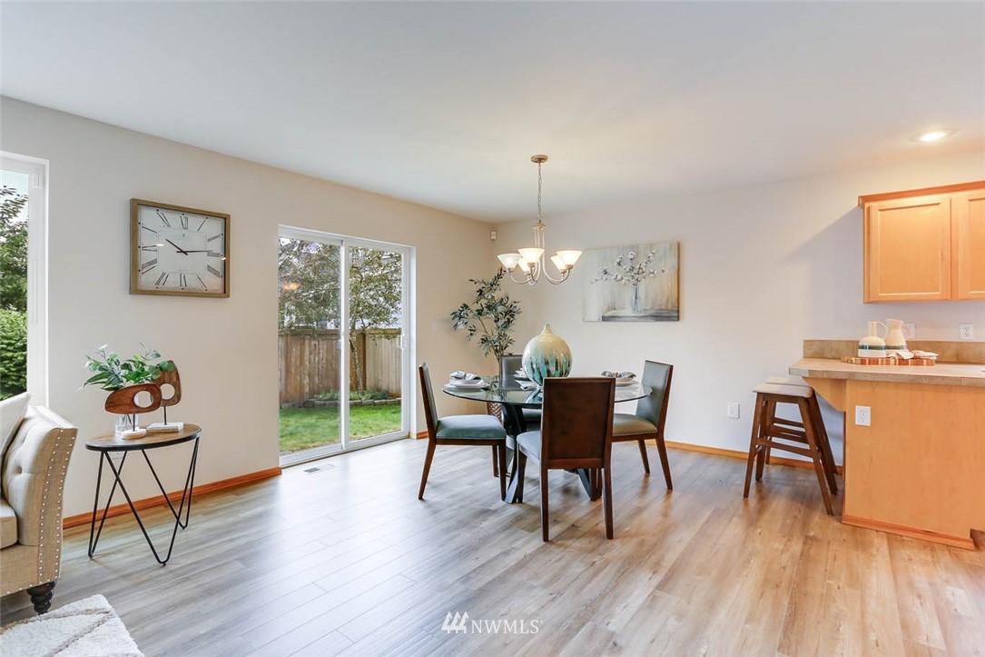6731 Southeast 3rd Street Renton, WA 98059 - Photo 9 of 31 a view of a dining room with furniture and wooden floor