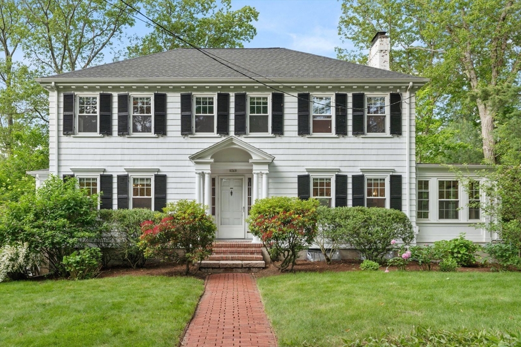 77 Meriam Street Lexington, MA 02420 - Photo 1 of 35 a front view of a house with a yard