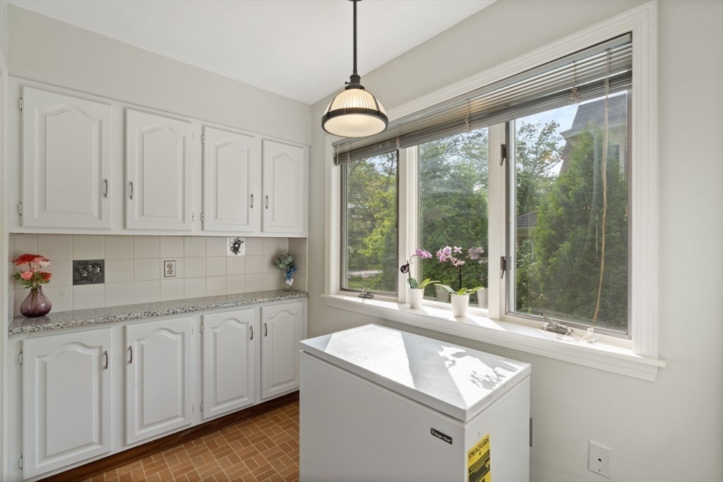 77 Meriam Street Lexington, MA 02420 - Photo 14 of 35 a kitchen that has a sink and a window