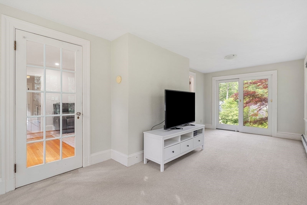 77 Meriam Street Lexington, MA 02420 - Photo 17 of 35 a view of livingroom with furniture and flat screen tv
