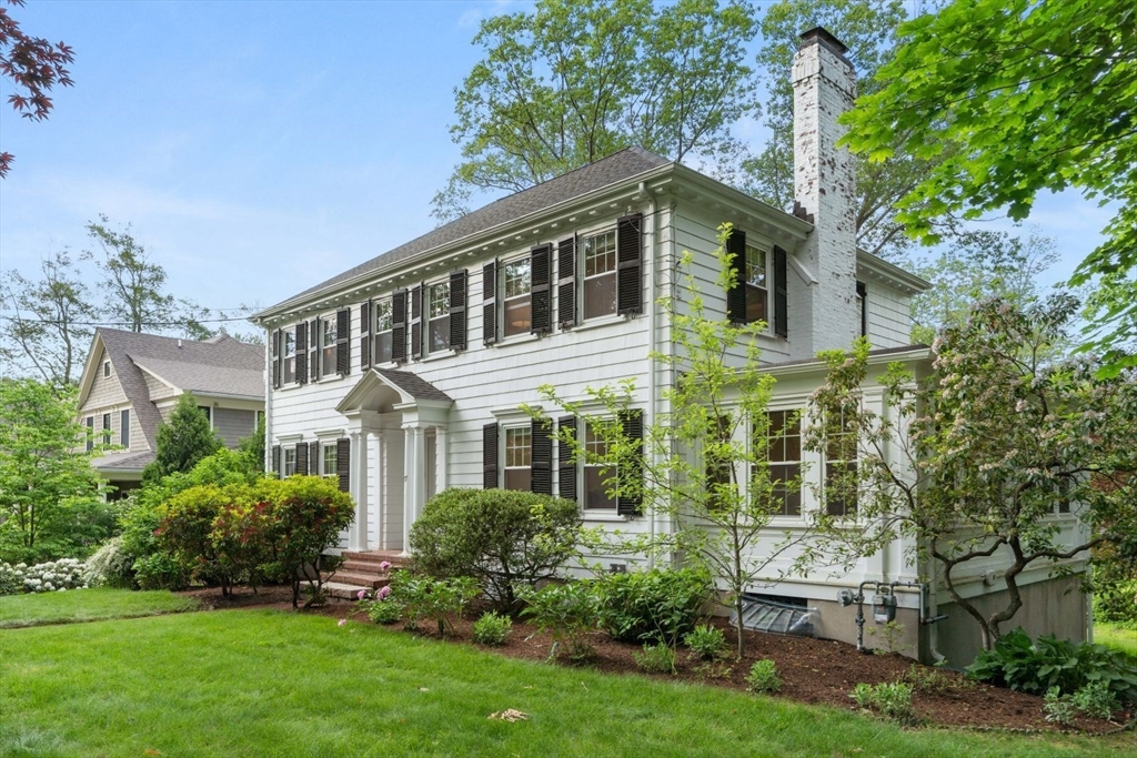77 Meriam Street Lexington, MA 02420 - Photo 2 of 35 a front view of a house with a yard