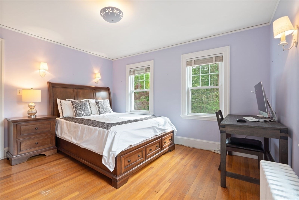 77 Meriam Street Lexington, MA 02420 - Photo 23 of 35 a bed sitting in a bedroom next to a window