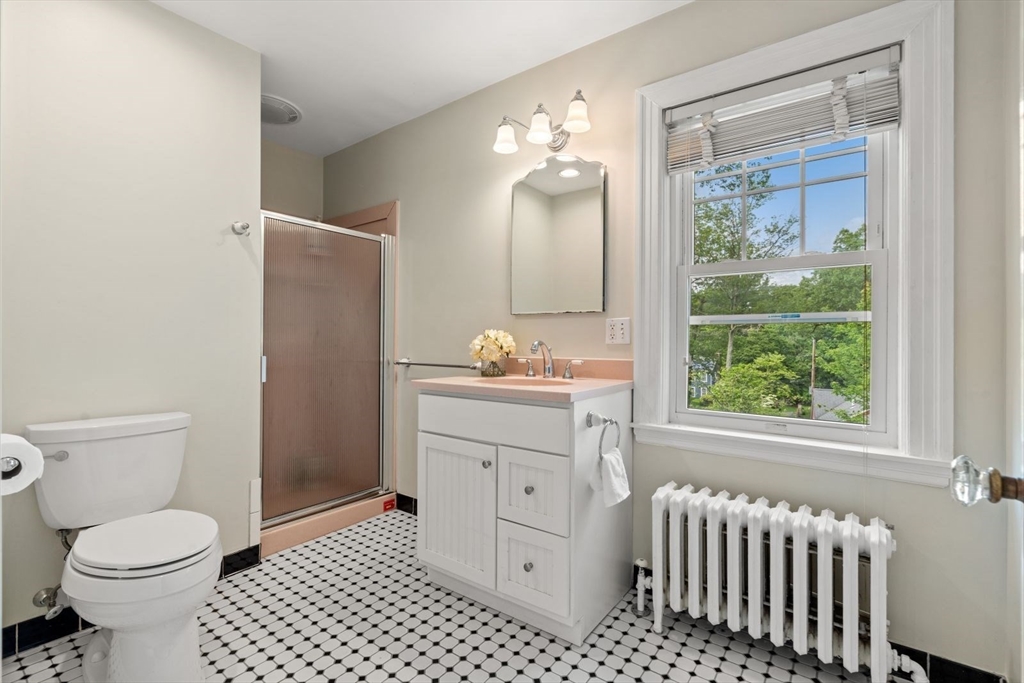 77 Meriam Street Lexington, MA 02420 - Photo 26 of 35 a bathroom with a sink toilet and a mirror