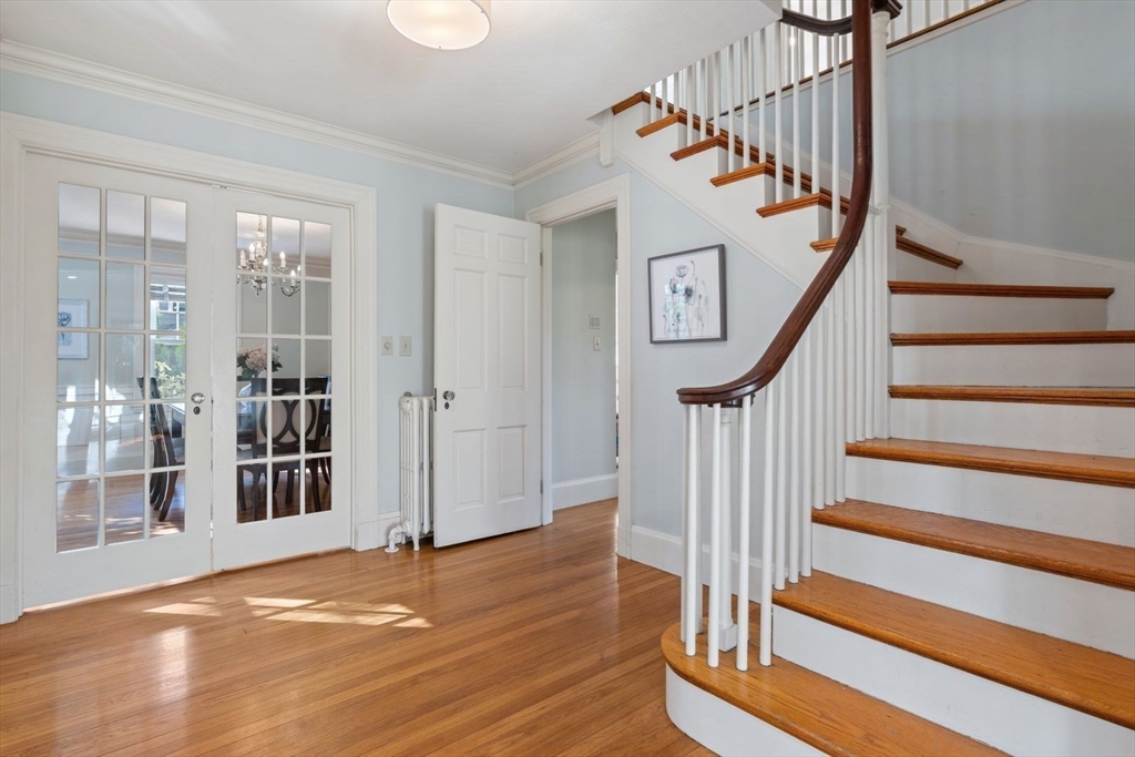 77 Meriam Street Lexington, MA 02420 - Photo 3 of 35 a view of entryway and hall with wooden floor