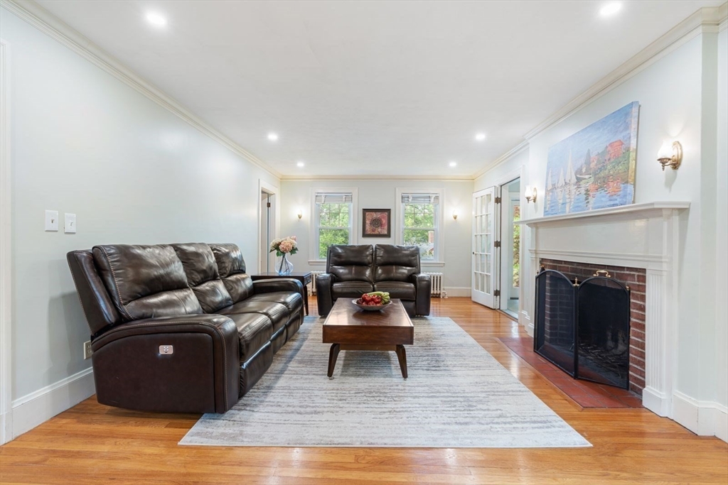 77 Meriam Street Lexington, MA 02420 - Photo 6 of 35 a living room with furniture and a fireplace
