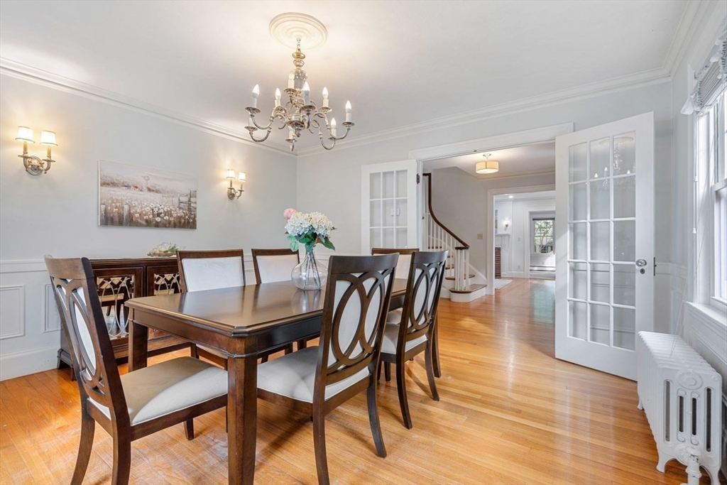 77 Meriam Street Lexington, MA 02420 - Photo 8 of 35 a view of a dining room with furniture and wooden floor