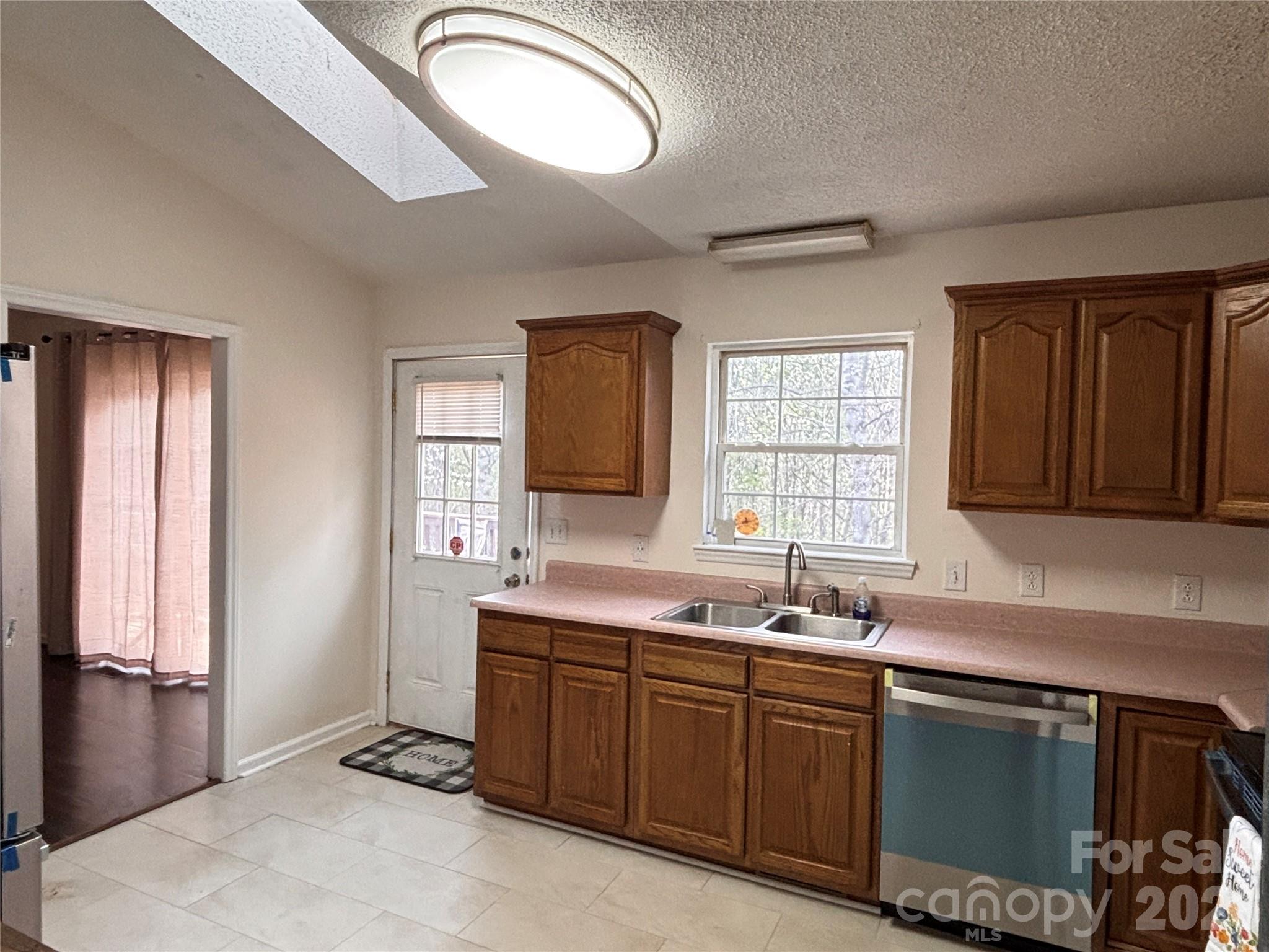 5164 Ralph Winchester Road Lenoir, NC 28645 - Photo 6 of 20 a kitchen with a sink stove and cabinets