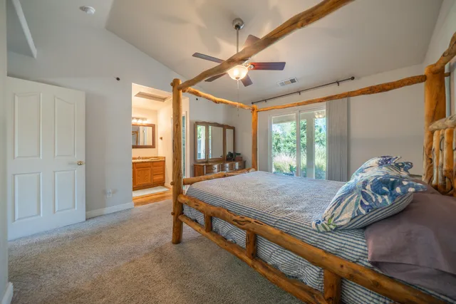 a view of a bedroom with furniture