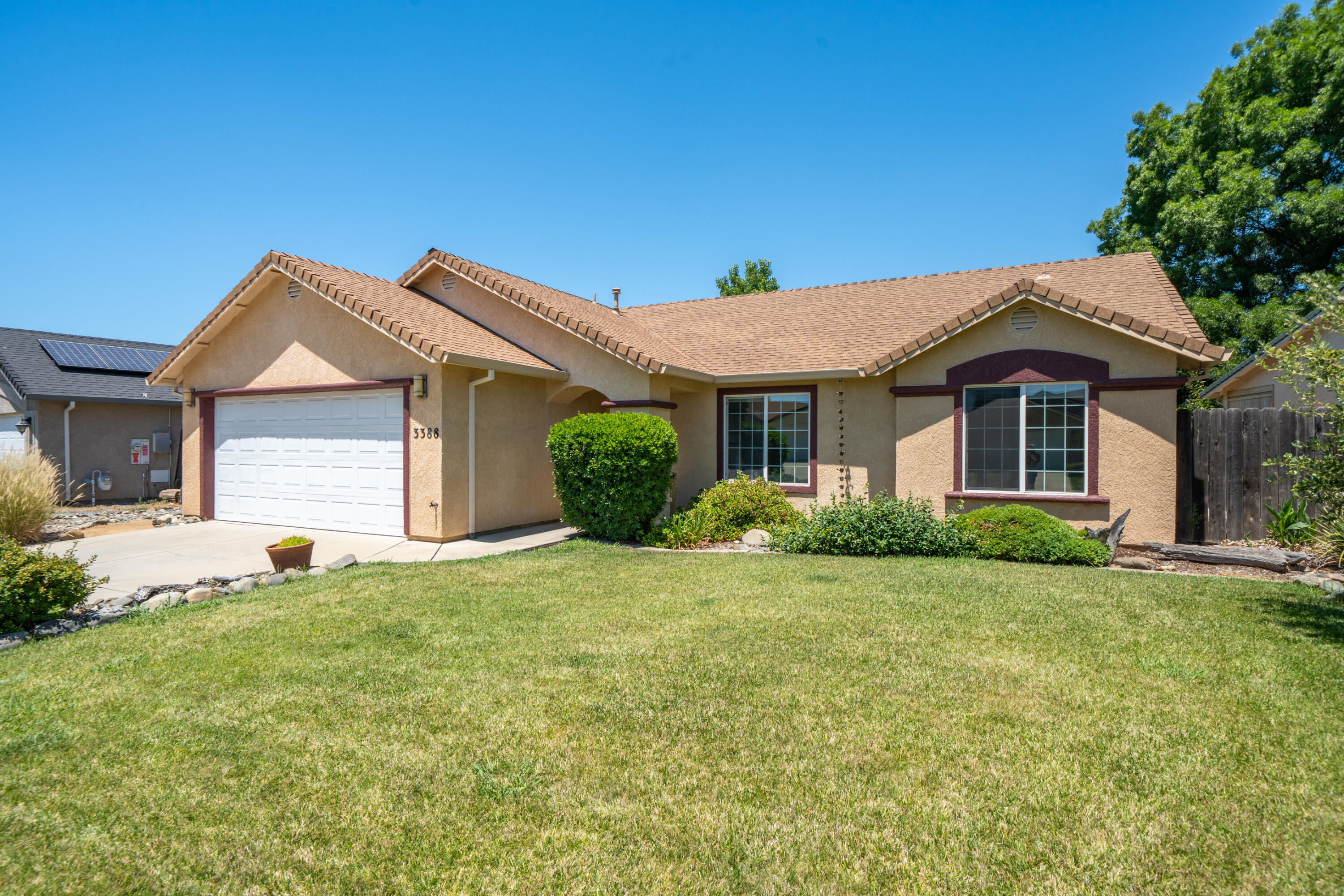 3388 Oak Street Anderson, CA 96007 - Photo 2 of 36 a front view of a house with a yard