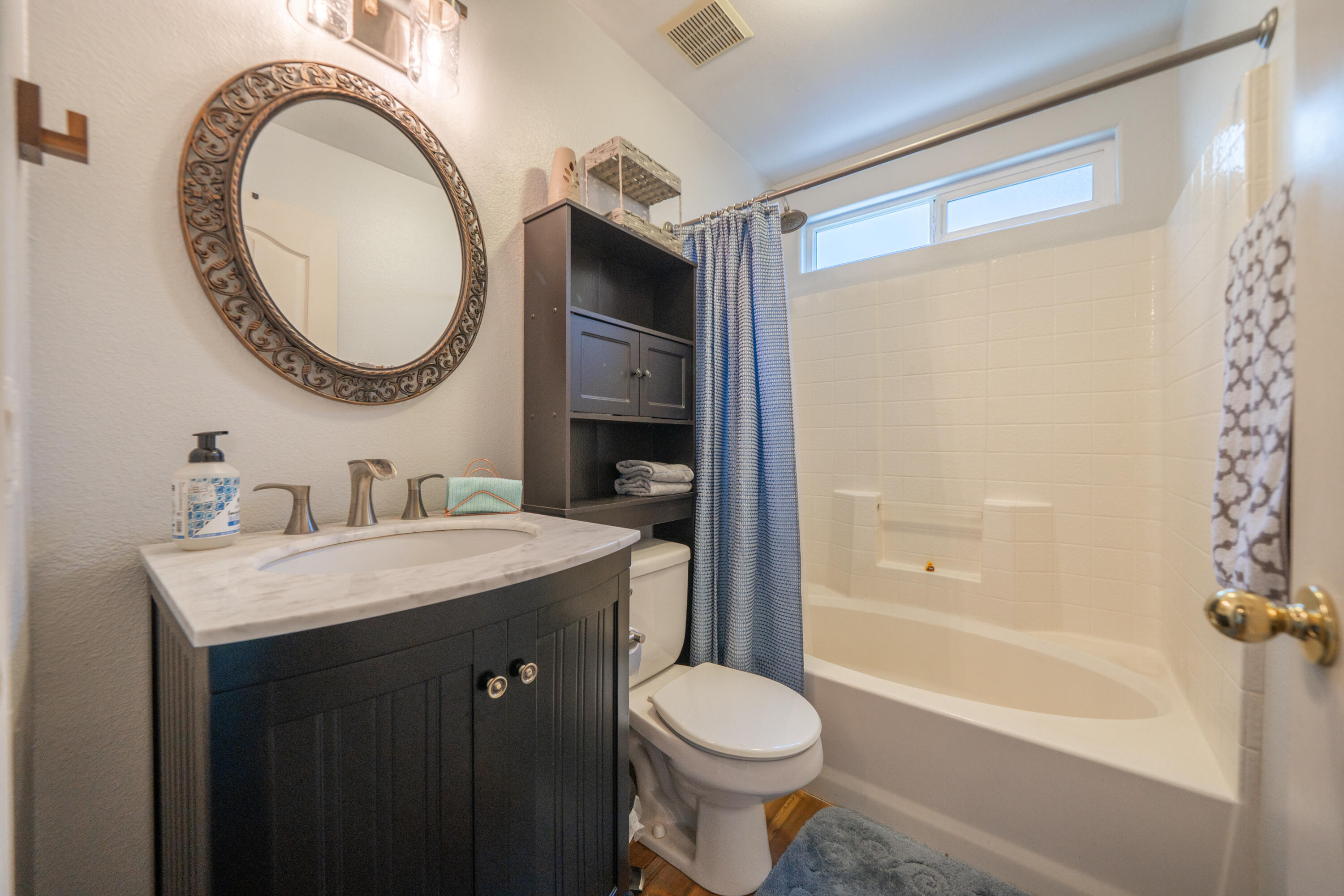3388 Oak Street Anderson, CA 96007 - Photo 22 of 36 a bathroom with a sink a toilet and a mirror